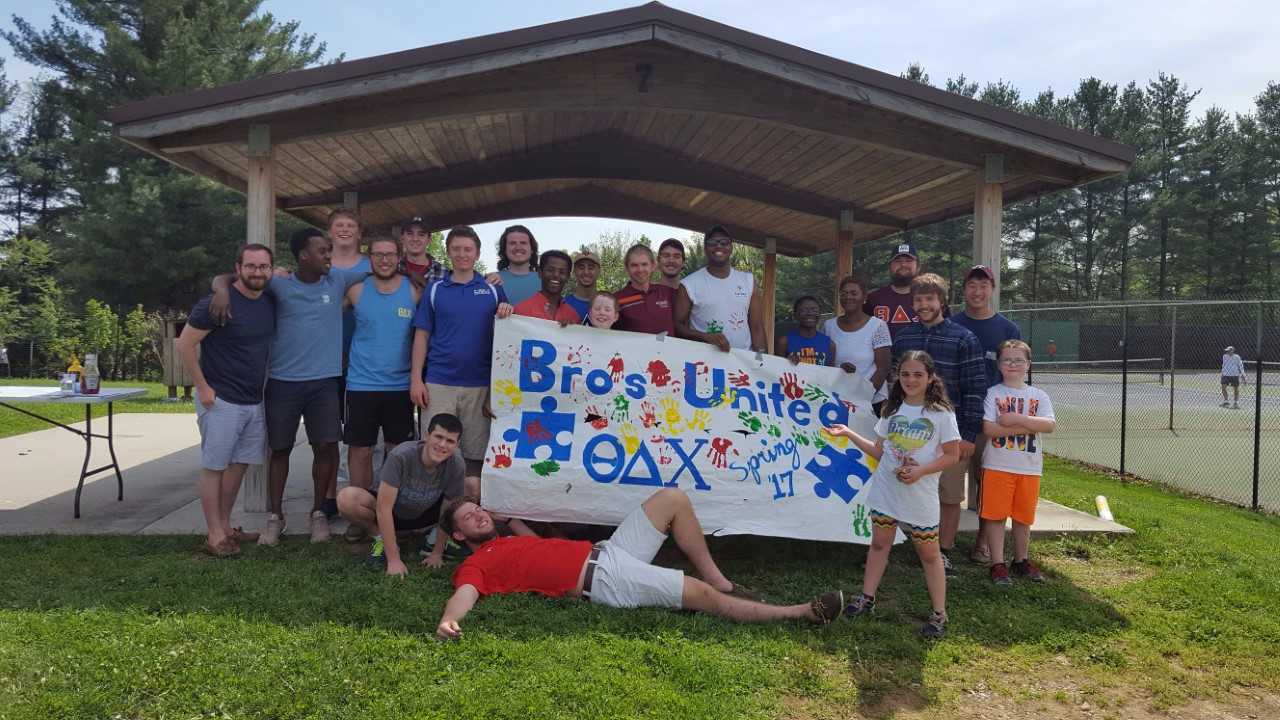 group photo in picnic shelter of organization Bros United