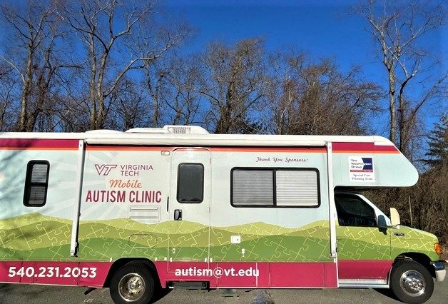 30 foot Class C RV with VT Mobile Autism Clinic logo and wrap and the Washington Group Special Care Planning Team logo