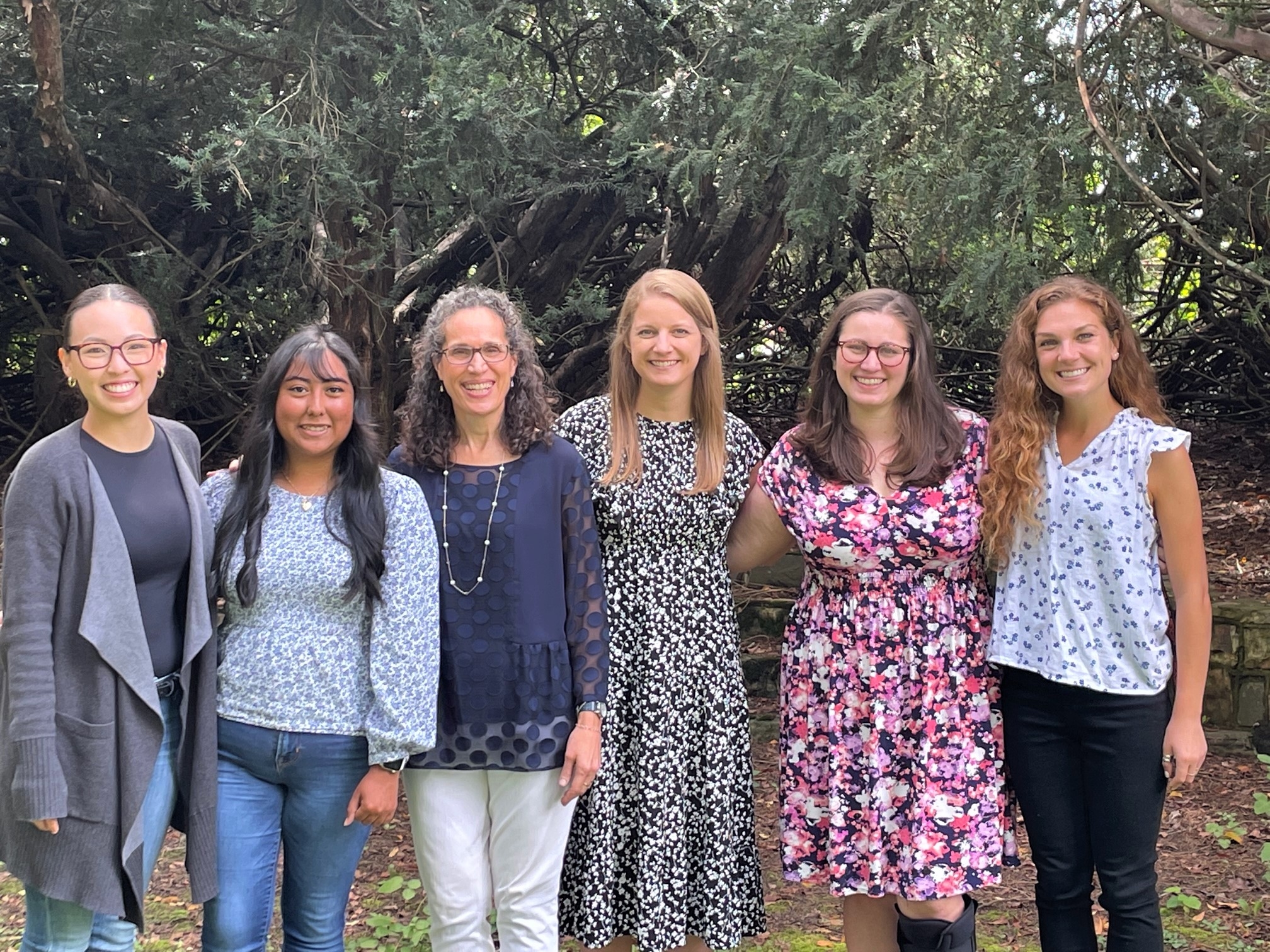 5 PANDA students and Dr. Scarpa lined up outside in September with a backdrop of trees