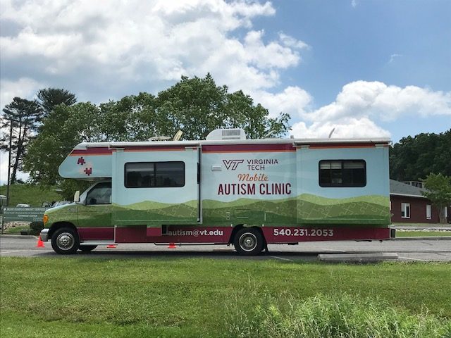 29 foot recreational vehicle with a wrap that says Virginia Tech Mobile Autism Clinic