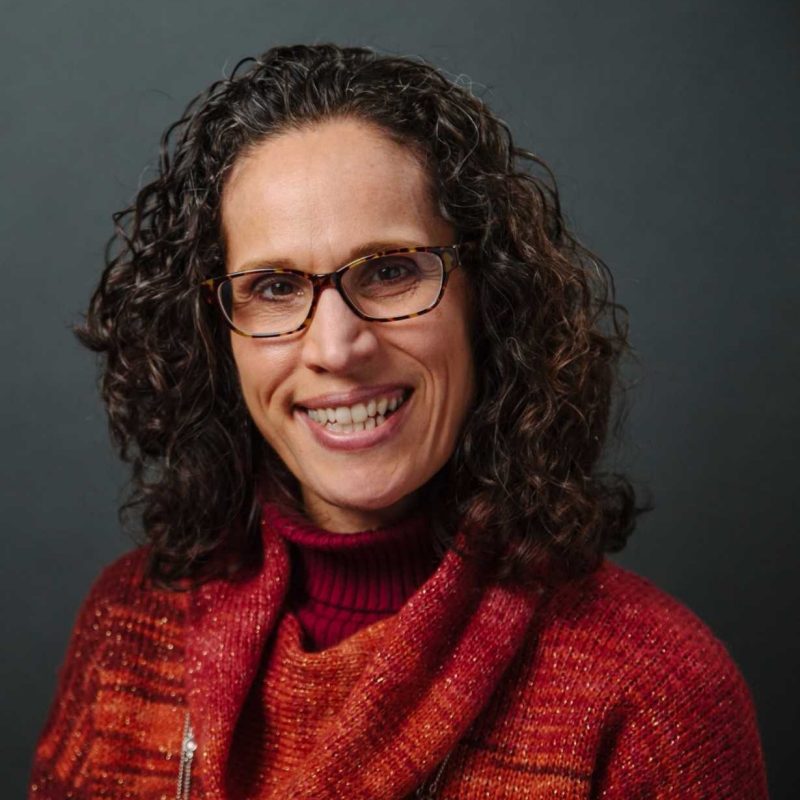 Angela Scarpa portrait with red jacket